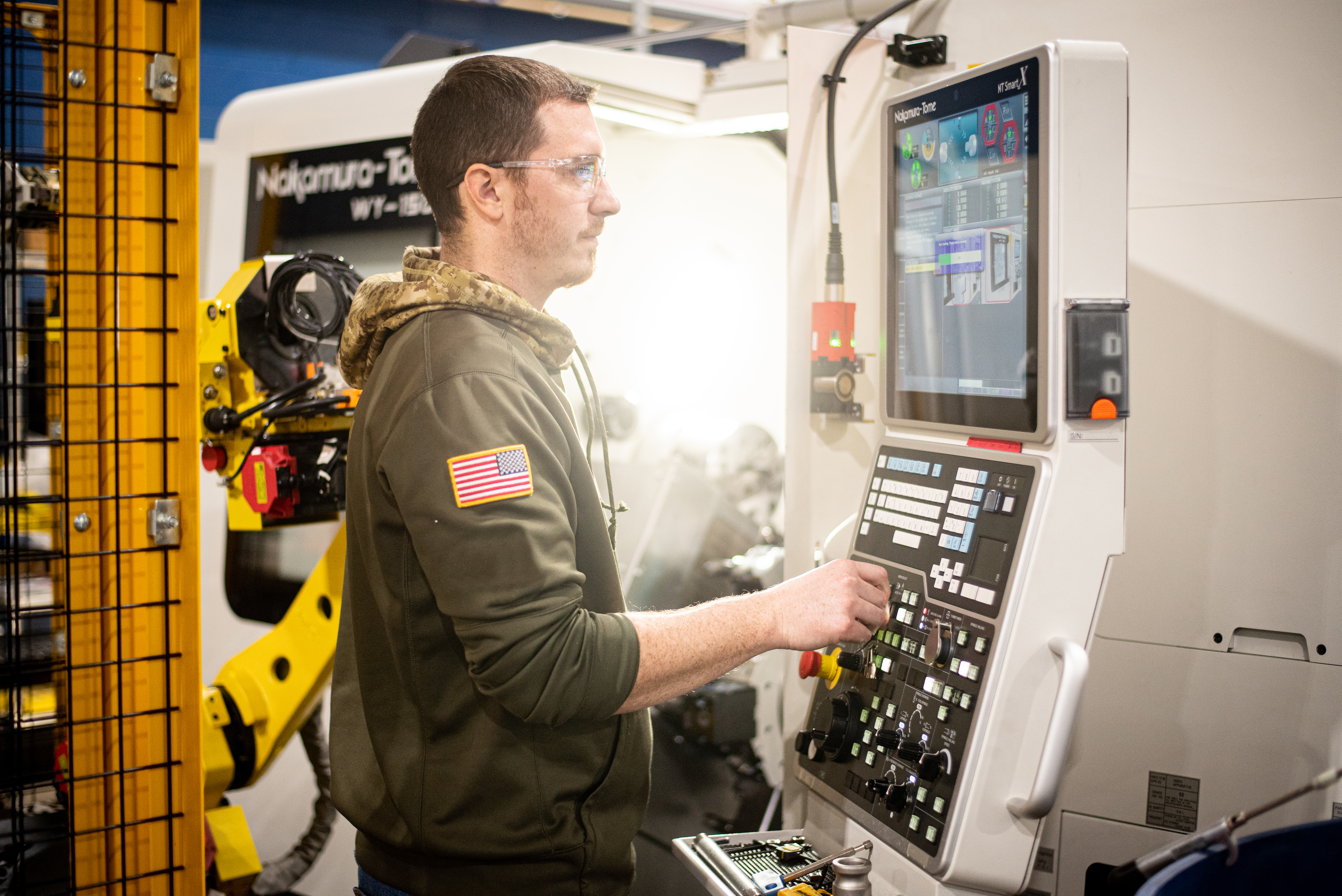 Programming a Computerized Numerical Control (CNC) machine.